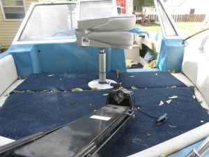 Bowrider area has storage below, trolling motor and seat have been removed.